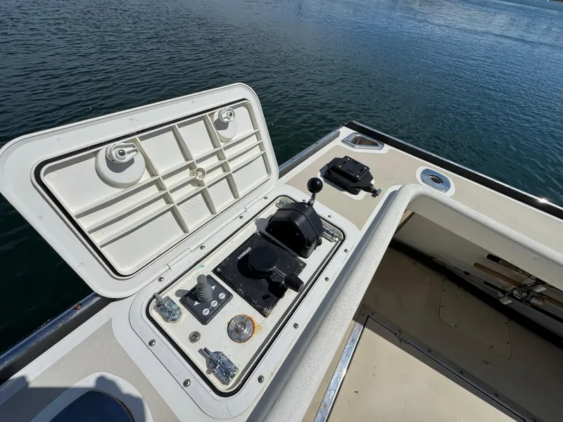 Slide: The Image of Control panel on a 2009 Northern Bay 36 boat, overlooking calm water. - 20