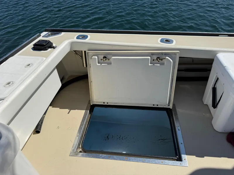 Slide: The Image of Open hatch on 2009 Northern Bay 36 boat deck, overlooking water. - 24