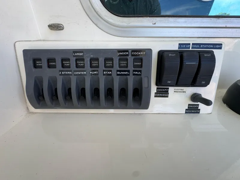 Slide: The Image of Control panel of a 2009 Northern Bay 36 boat with various switches and labels. - 36