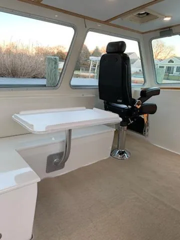 Slide: The Image of Interior of 2009 Northern Bay 36 boat with seating and table. - 42