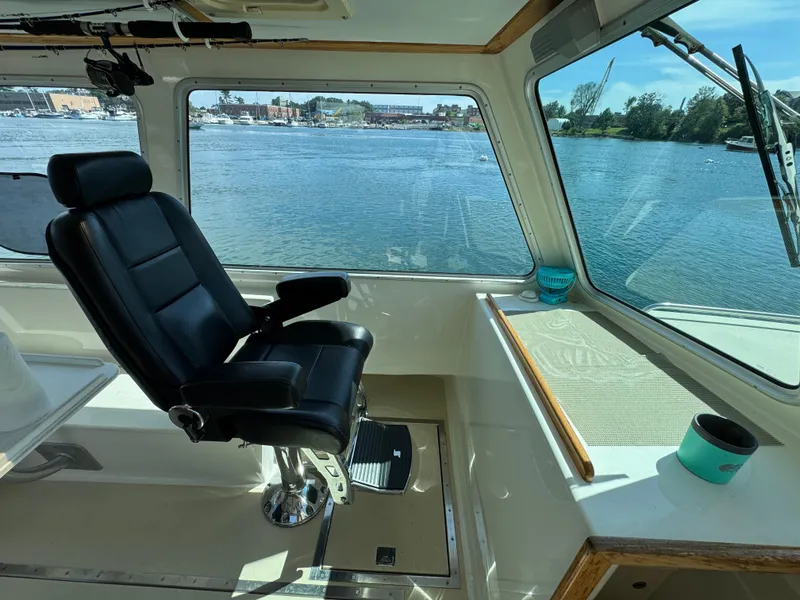 Slide: The Image of Interior of 2009 Northern Bay 36 boat with captain's chair and scenic water view. - 44