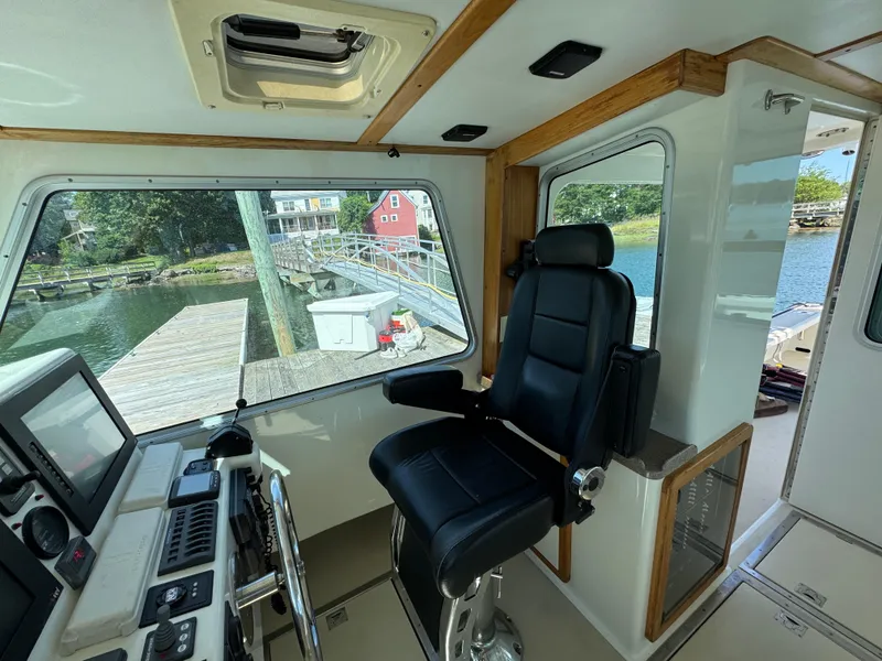 Slide: The Image of Interior of a 2009 Northern Bay 36 boat with helm and captain's chair. - 45