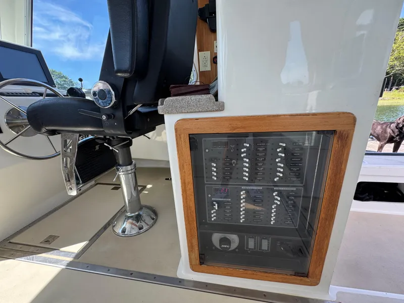 Slide: The Image of Interior of a 2009 Northern Bay 36 boat showing control panel and captain's chair. - 46