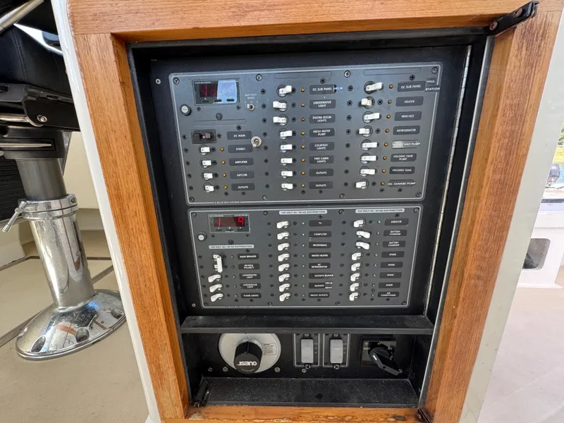 Slide: The Image of Electrical control panel on a 2009 Northern Bay 36 boat, featuring various switches and gauges. - 47