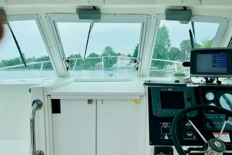 Slide: The Image of Interior view of a 2002 Albin 28 Tournament Express boat cockpit with navigation equipment. - 5