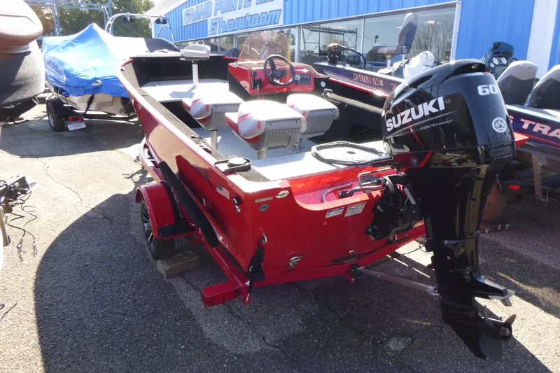 Slide: The Image of 2025 Smoker Craft Lazer 161 boat with Suzuki 60 outboard motor, parked outdoors. - 2