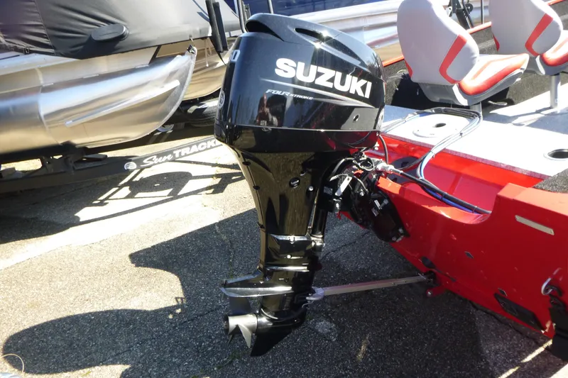 Slide: The Image of 2025 Smoker Craft Lazer 161 boat with Suzuki outboard motor, red and silver design. - 9
