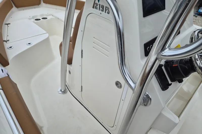 Slide: The Image of 2026 Key West 219 FS boat interior with console and seating area. - 12