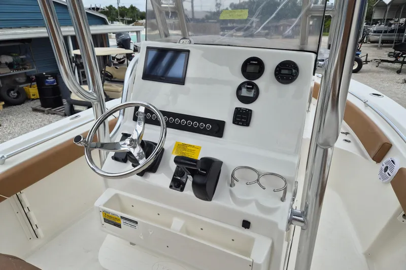 Slide: The Image of Steering console of 2026 Key West 219 FS boat with modern controls and gauges. - 6