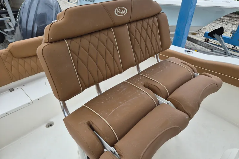 Slide: The Image of Brown leather seating on 2026 Key West 219 FS boat, featuring diamond stitching. - 8