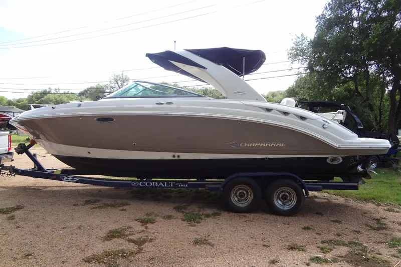 Slide: The Image of 2008 Chaparral 276 SSX boat on trailer, side view, outdoors. - 10