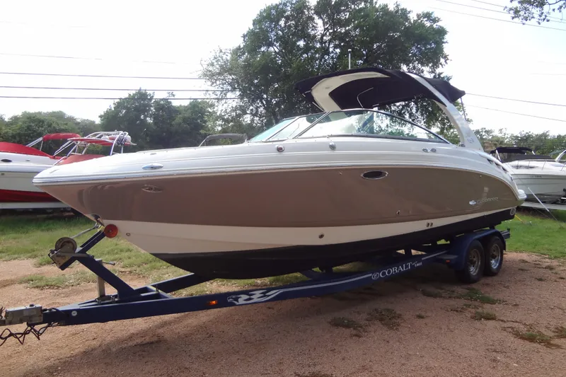 Slide: The Image of 2008 Chaparral 276 SSX boat on trailer, parked outdoors. - 12