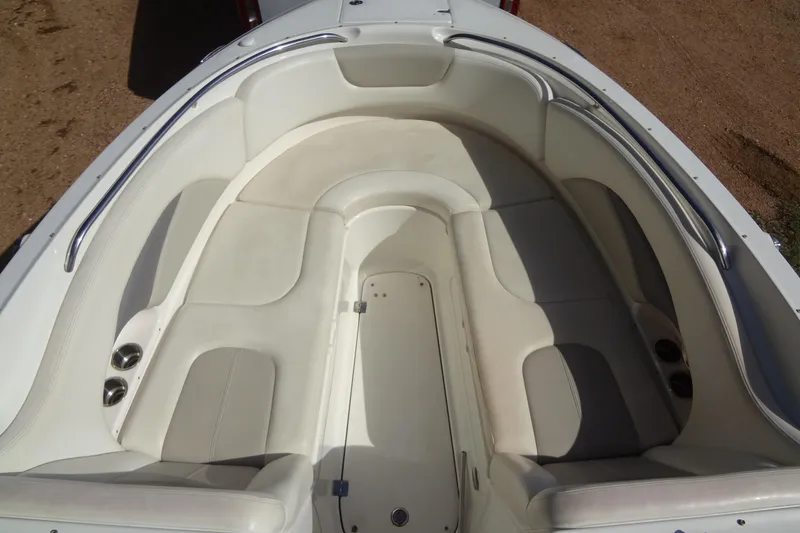 Slide: The Image of 2008 Chaparral 276 SSX boat interior with white cushioned seating and stainless steel railings. - 15