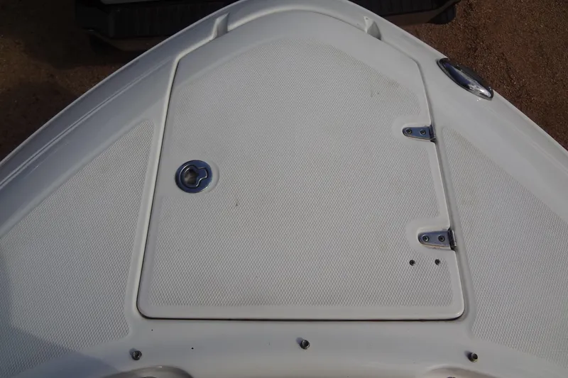 Slide: The Image of Bow of 2008 Chaparral 276 SSX boat with textured white surface and metal fittings. - 16