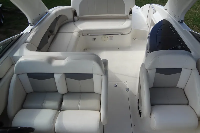 Slide: The Image of 2008 Chaparral 276 SSX boat interior with white leather seating and spacious layout. - 17