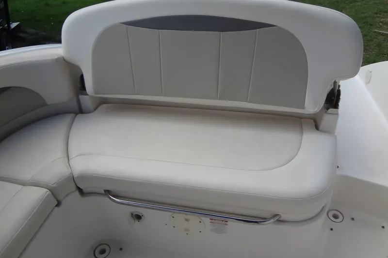 Slide: The Image of 2008 Chaparral 276 SSX boat seating area with white cushioned upholstery. - 19