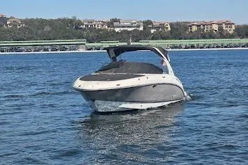 Slide: The Image of 2008 Chaparral 276 SSX boat cruising on a sunny lake. - 2