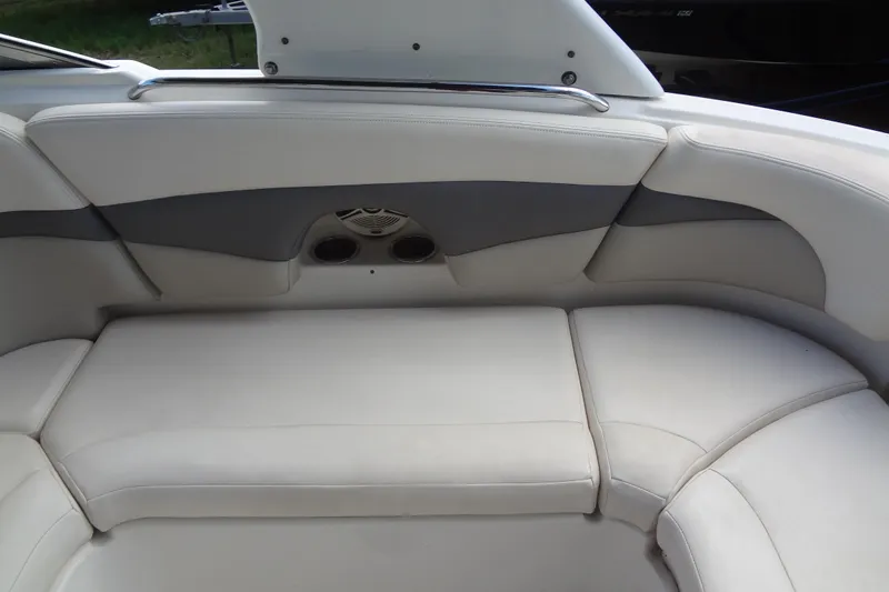 Slide: The Image of 2008 Chaparral 276 SSX boat interior with cushioned seating and built-in speakers. - 20
