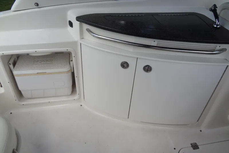 Slide: The Image of Interior of 2008 Chaparral 276 SSX boat with storage compartment and cooler. - 22