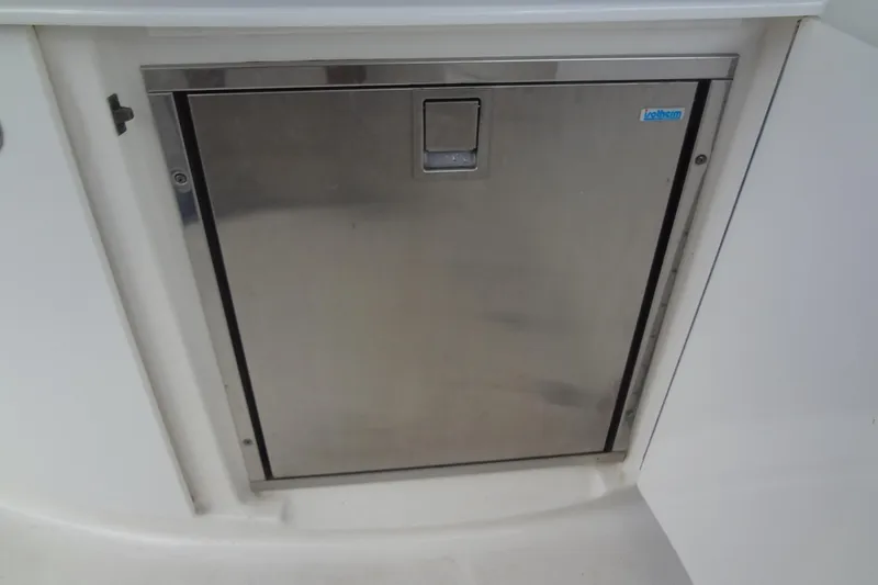 Slide: The Image of Stainless steel compartment door on 2008 Chaparral 276 SSX boat. - 23