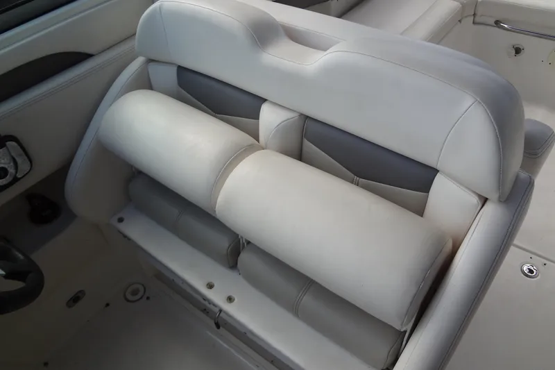 Slide: The Image of 2008 Chaparral 276 SSX boat interior with beige leather seating. - 25
