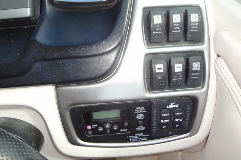 Slide: The Image of Control panel of a 2008 Chaparral 276 SSX boat with various switches and buttons. - 31
