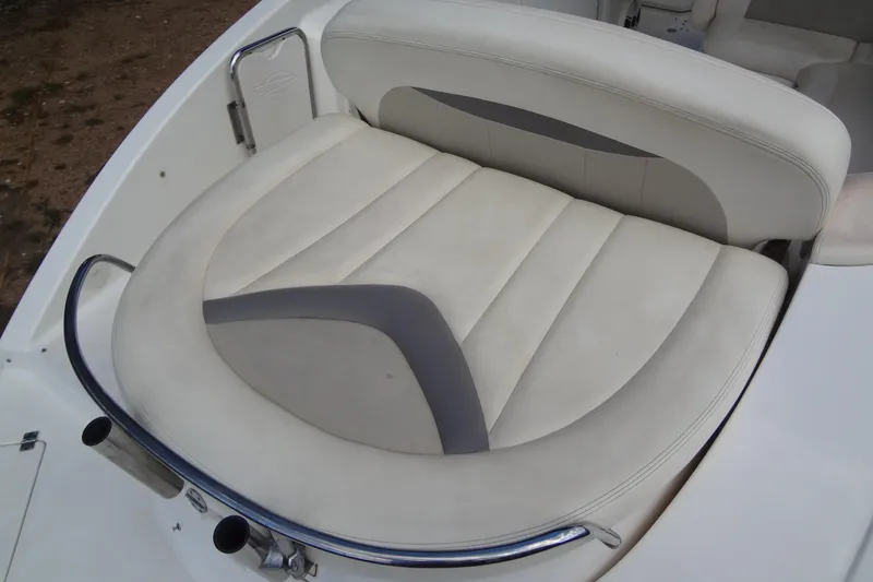 Slide: The Image of 2008 Chaparral 276 SSX boat seat with white and gray upholstery. - 36