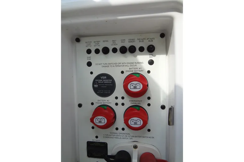 Slide: The Image of Control panel of a 2008 Chaparral 276 SSX boat with battery switches and indicators. - 41