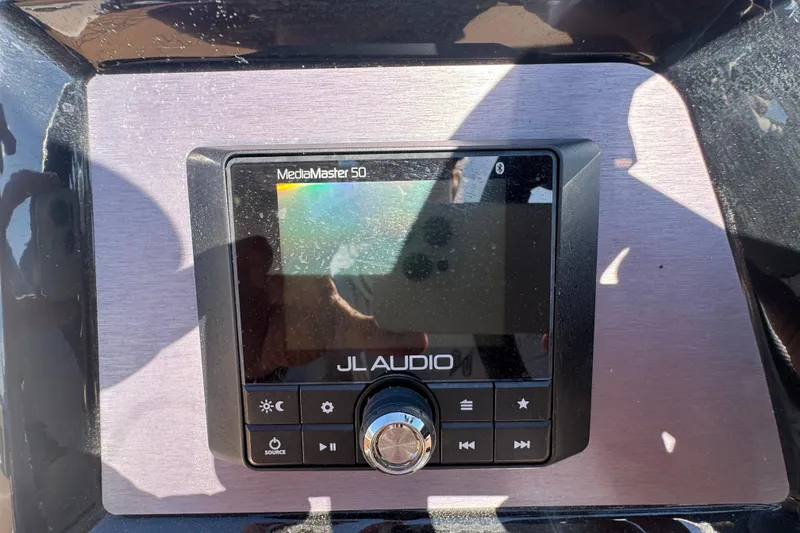 Slide: The Image of JL Audio MediaMaster 50 control panel on 2021 MasterCraft NXT24 boat. - 13