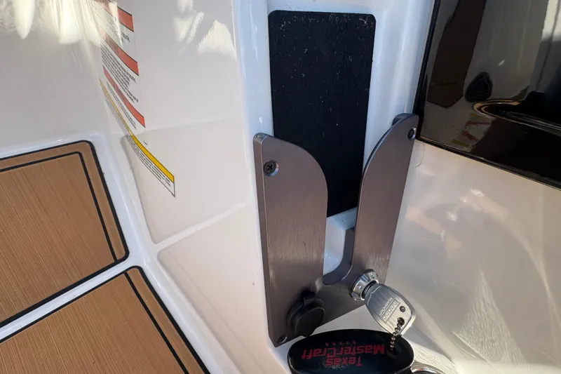 Slide: The Image of 2021 MasterCraft NXT24 boat interior with key ignition and safety instructions. - 15