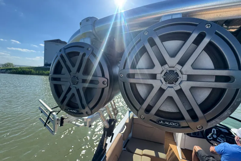 Slide: The Image of 2021 MasterCraft NXT24 boat with JL Audio speakers on a sunny day. - 26