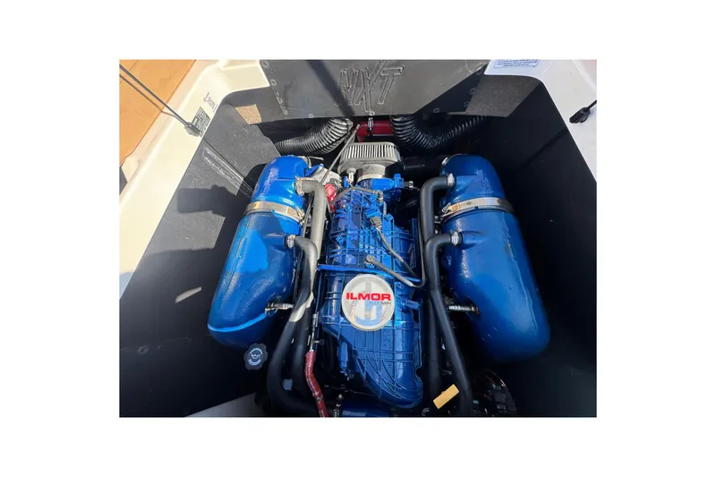 Slide: The Image of 2021 MasterCraft NXT24 engine compartment with Ilmor marine engine. - 28