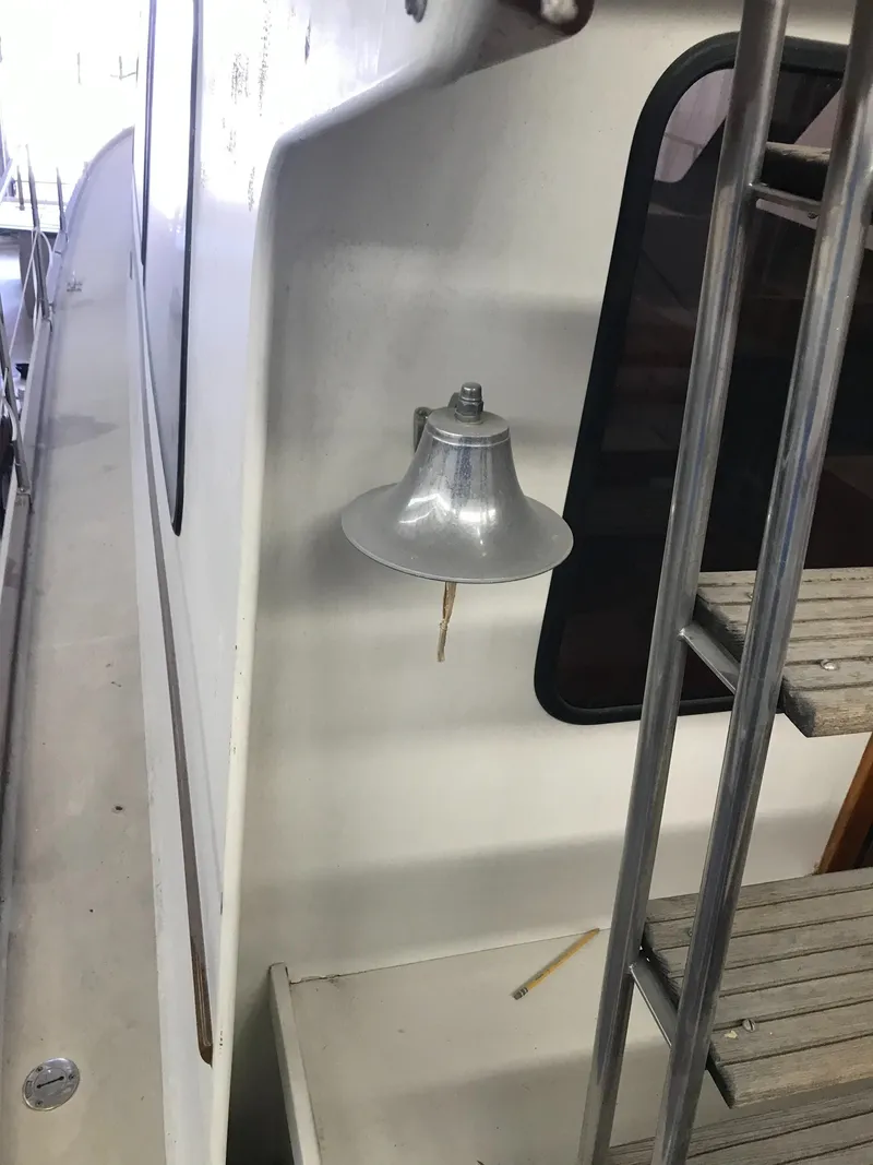 Slide: The Image of 1987 Lyman-Morse Hunt 42 boat with bell and ladder. - 12