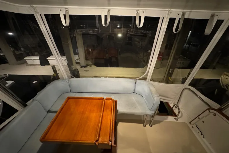 Slide: The Image of Interior view of 1987 Lyman-Morse Hunt 42 yacht with seating and wooden table. - 22