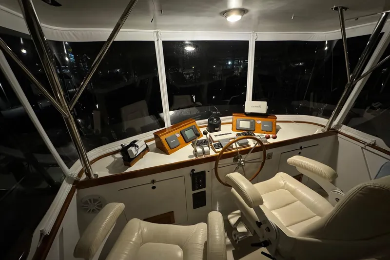Slide: The Image of Helm of 1987 Lyman-Morse Hunt 42 yacht with navigation equipment and leather seats. - 27
