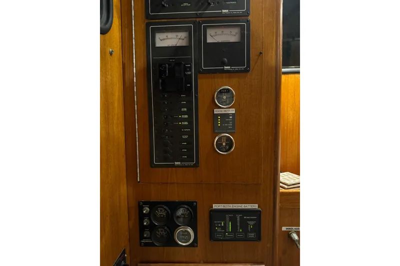 Slide: The Image of Control panel of a 1987 Lyman-Morse Hunt 42 boat with gauges and switches. - 28