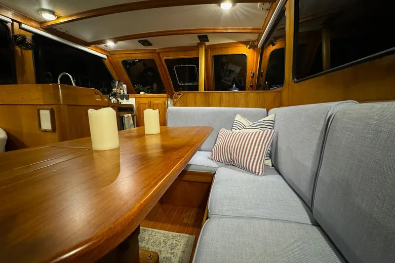 Slide: The Image of Interior of 1987 Lyman-Morse Hunt 42 yacht with cozy seating and wooden table. - 32