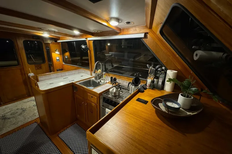 Slide: The Image of Interior of 1987 Lyman-Morse Hunt 42 yacht with wooden cabinetry and modern kitchen amenities. - 38