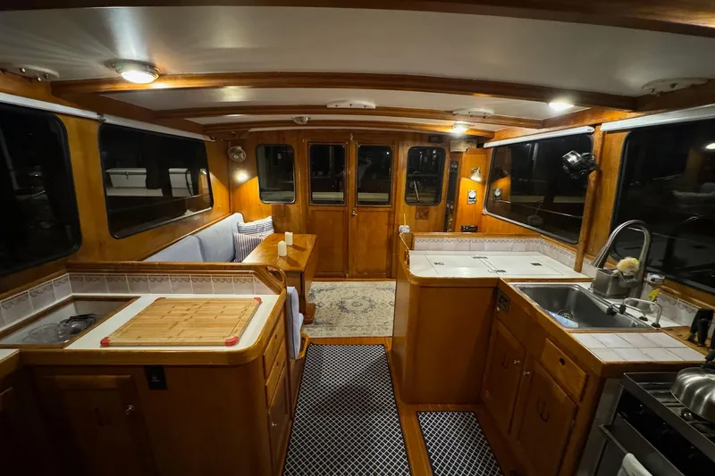 Slide: The Image of Interior of 1987 Lyman-Morse Hunt 42 yacht with wooden cabinetry and modern kitchen amenities. - 39