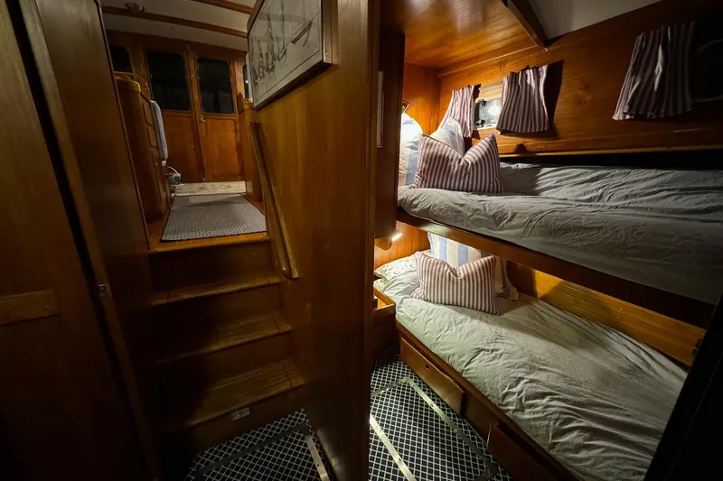 Slide: The Image of Interior of 1987 Lyman-Morse Hunt 42 yacht with cozy wooden bunk beds. - 46