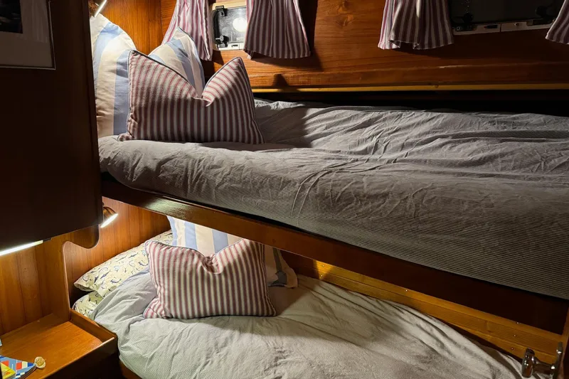 Slide: The Image of Cozy cabin bunks with striped pillows on 1987 Lyman-Morse Hunt 42 yacht. - 47