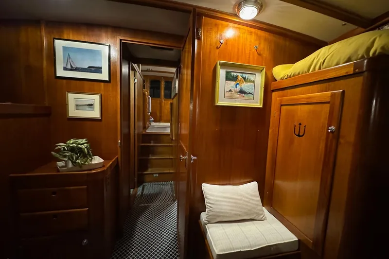 Slide: The Image of Cozy interior of 1987 Lyman-Morse Hunt 42 yacht with wooden paneling and nautical decor. - 51