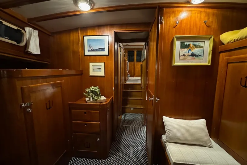 Slide: The Image of Luxurious wooden interior of 1987 Lyman-Morse Hunt 42 yacht cabin with artwork and seating. - 53