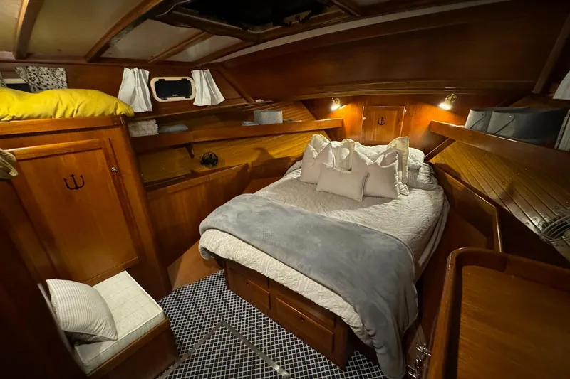 Slide: The Image of Cozy cabin interior of 1987 Lyman-Morse Hunt 42 yacht with wooden finish and comfortable bedding. - 56