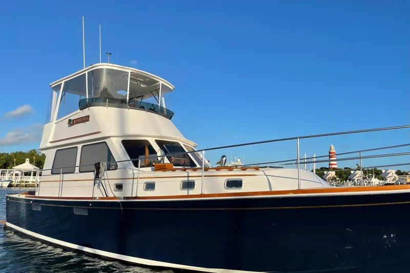 Slide: The Image of 1987 Lyman-Morse Hunt 42 yacht docked under clear blue sky. - 9