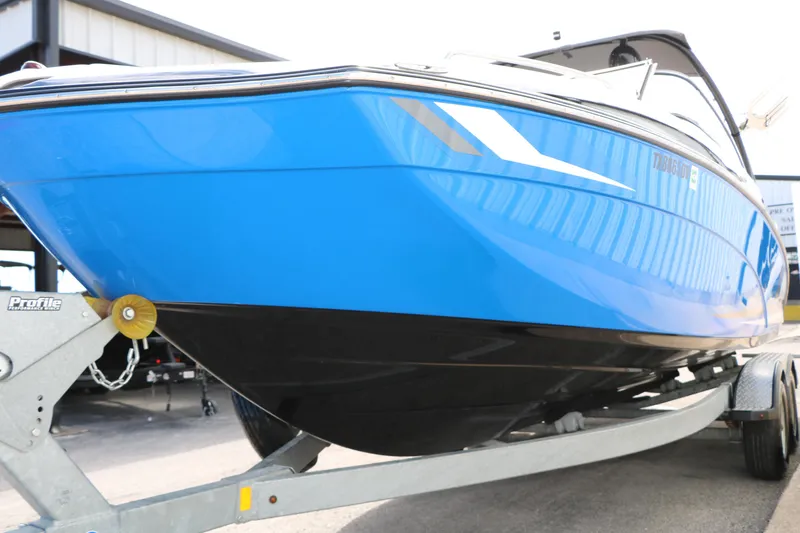 Slide: The Image of 2017 Yamaha Boats AR240 HO in blue on trailer, side view. - 12