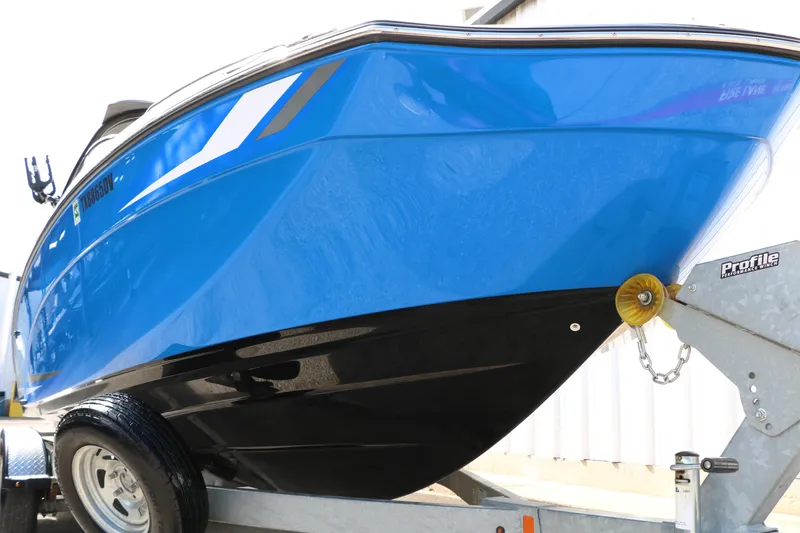 Slide: The Image of 2017 Yamaha Boats AR240 HO in blue on trailer, showcasing sleek design and vibrant color. - 14