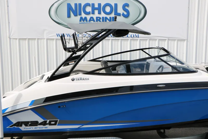 Slide: The Image of 2017 Yamaha AR240 HO boat in blue and white at Nichols Marine dealership. - 16