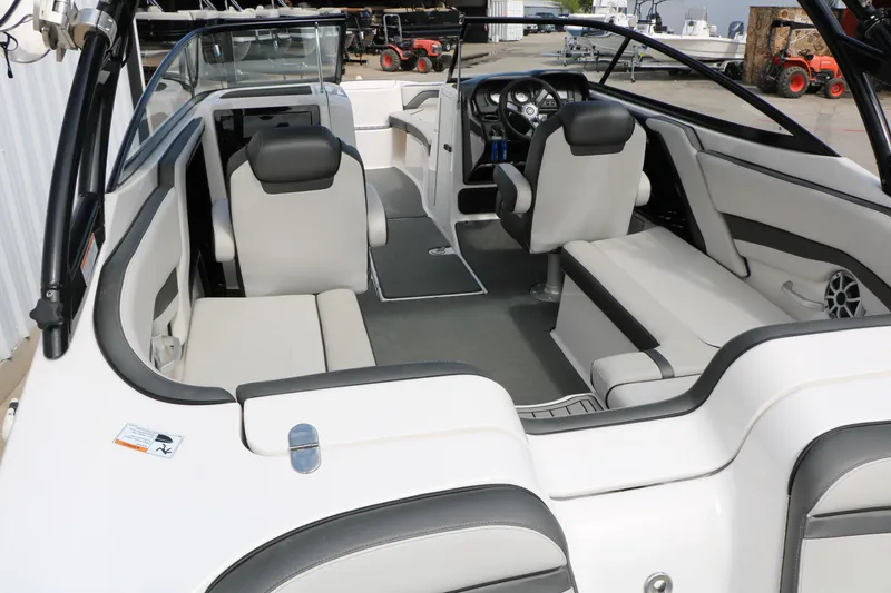 Slide: The Image of 2017 Yamaha Boats AR240 HO interior with sleek seating and modern dashboard design. - 20