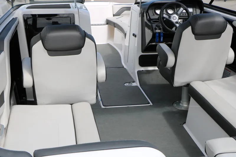 Slide: The Image of 2017 Yamaha Boats AR240 HO interior with modern seating and steering console. - 21